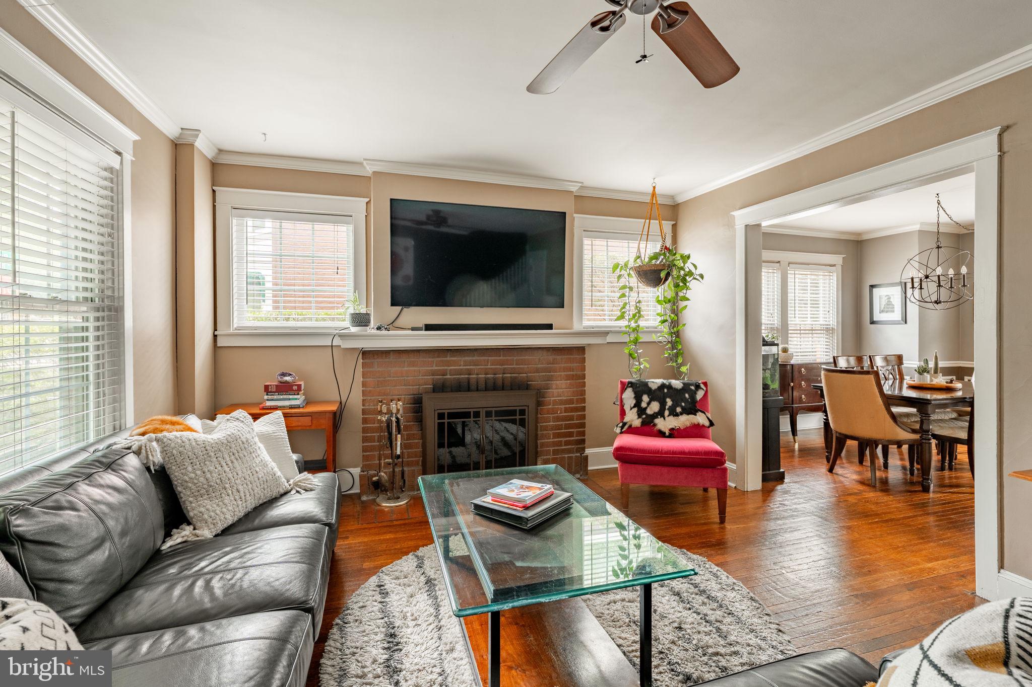 227 Ruby Street Lancaster, PA 17603 - Photo 6 of 42 a living room with furniture flat screen tv and a fireplace