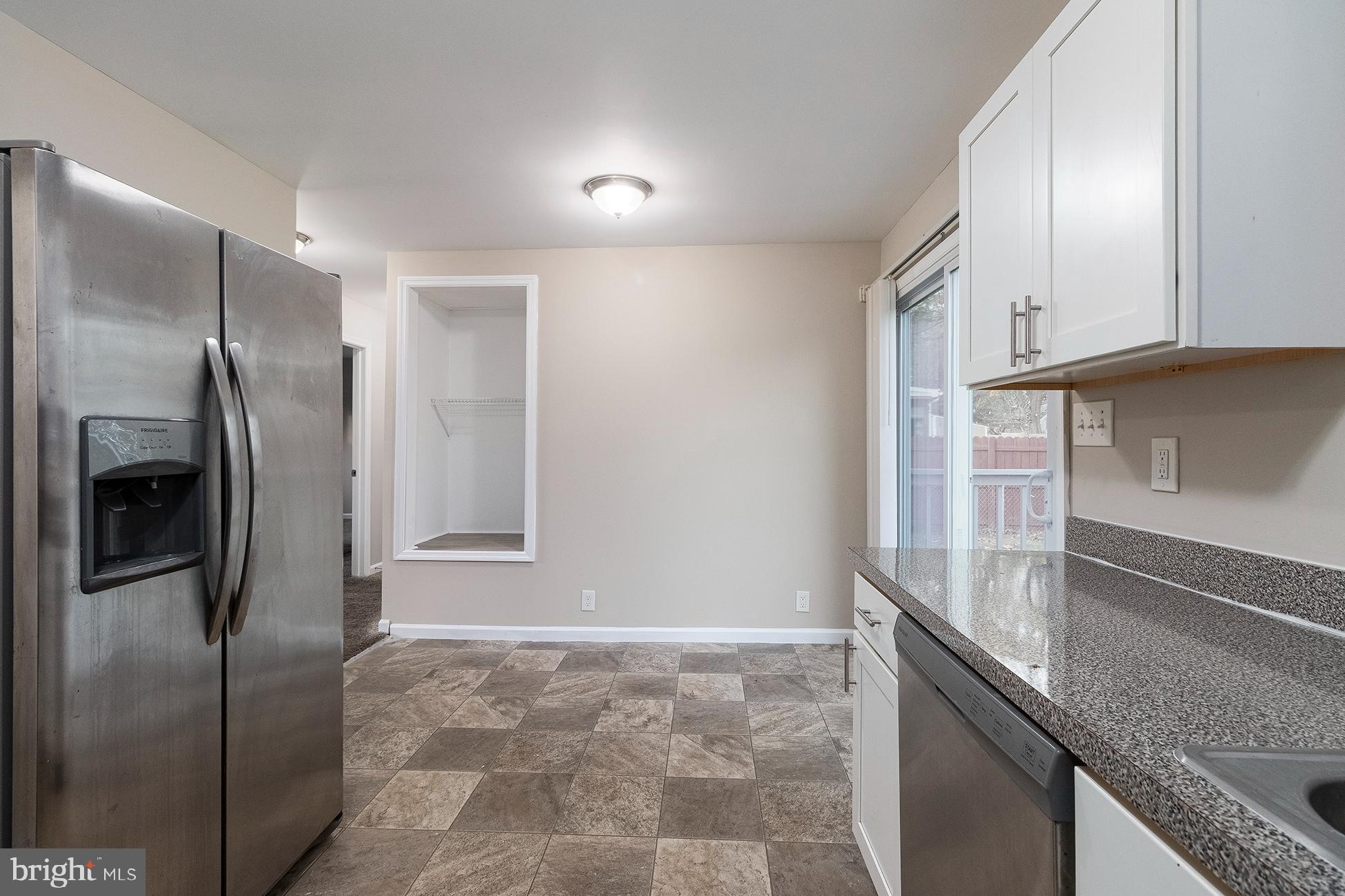 205 Starling Lane Mount Holly, NJ 08060 - Photo 6 of 21 a kitchen with granite countertop a refrigerator and a sink