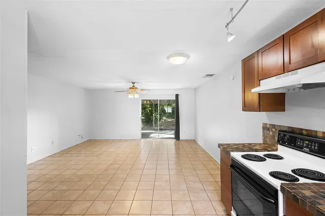 a kitchen with a stove and a microwave