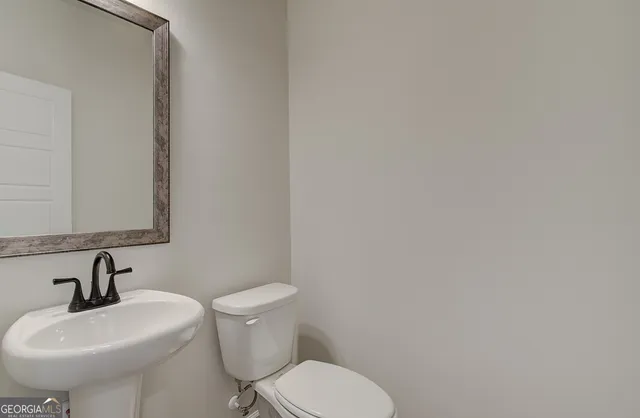 a large bathroom with a granite countertop shower a sink and a mirror