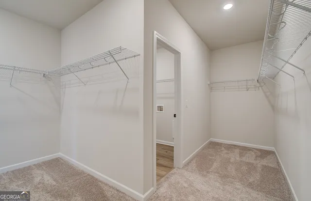 a front view of a house with a yard table and chairs
