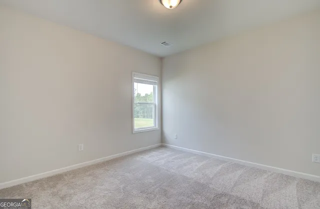 a view of a kitchen with wooden floor