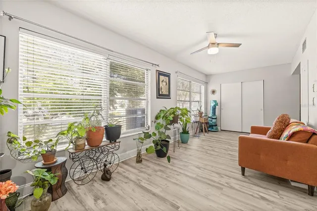a living room with furniture and a large window