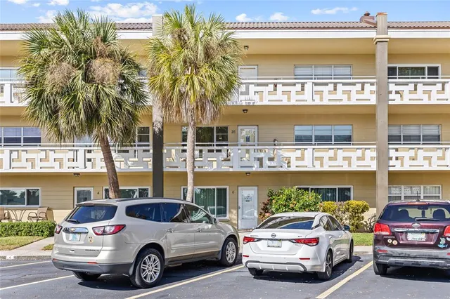 a view of cars parked in front of a building