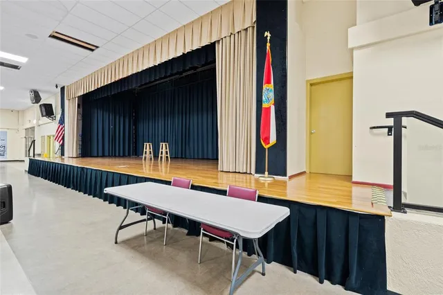 a room with lots of table and chairs