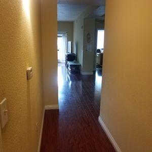 2177 Alum Rock Avenue, Unit 211 San Jose, CA 95116 - Photo 14 of 46 a view of a hallway with wooden floor