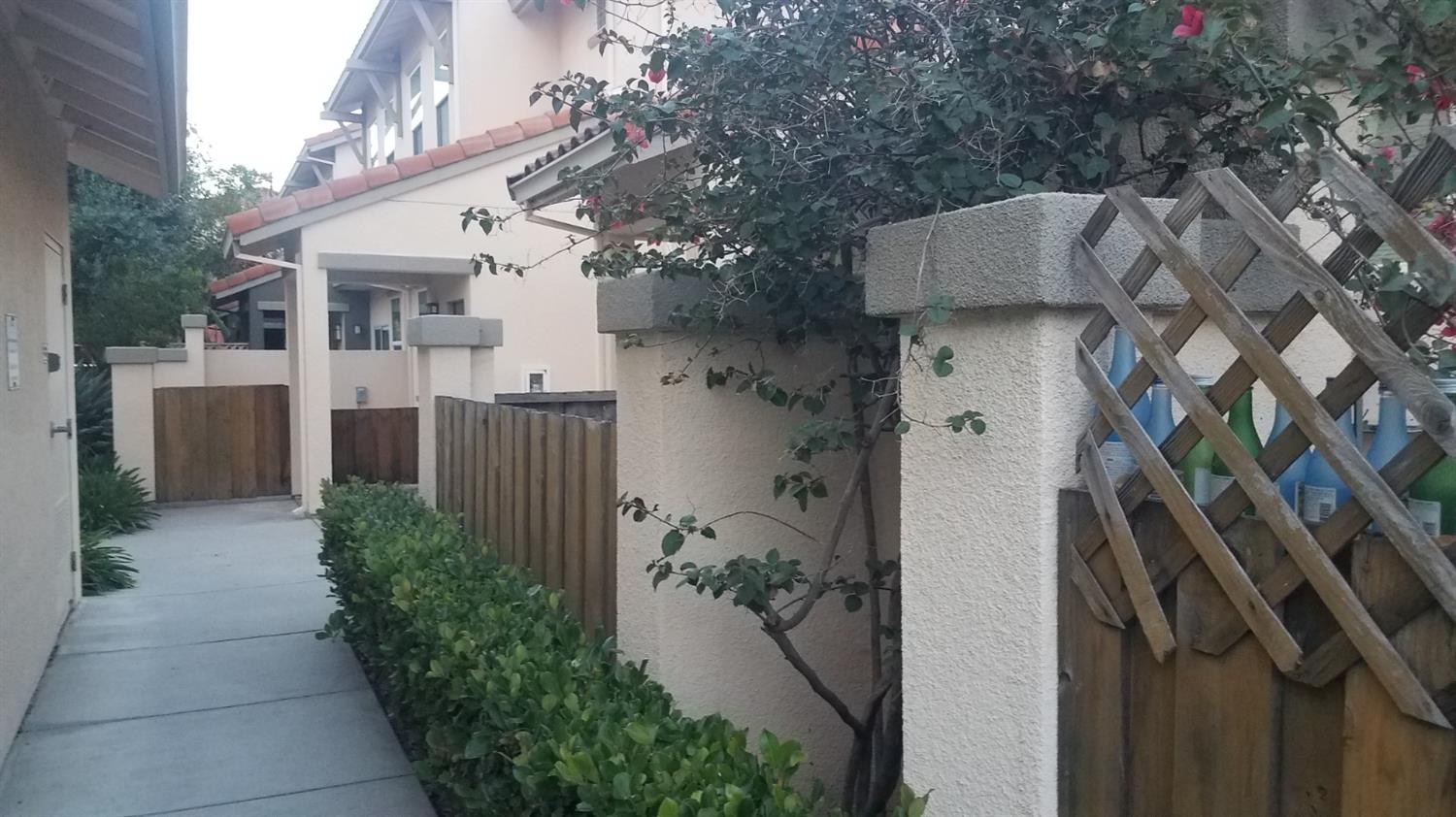 2177 Alum Rock Avenue, Unit 211 San Jose, CA 95116 - Photo 31 of 46 a view of a house with a flower plants next to a yard