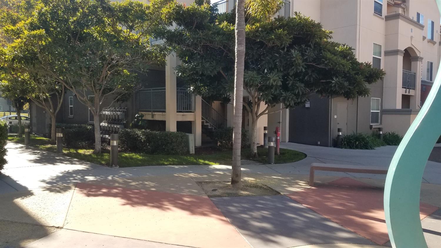 2177 Alum Rock Avenue, Unit 211 San Jose, CA 95116 - Photo 39 of 46 a view of a house with a yard