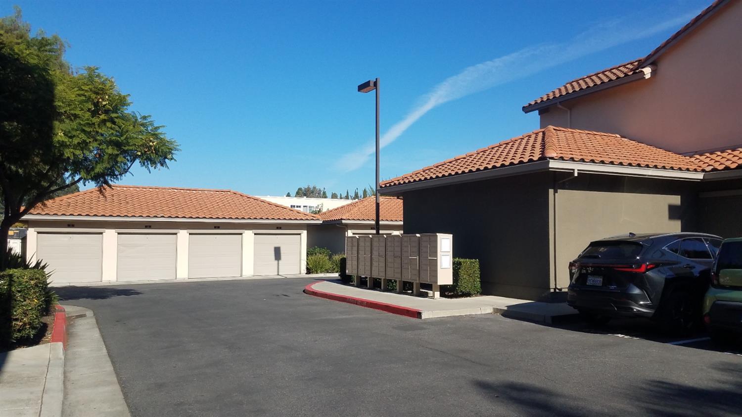 2177 Alum Rock Avenue, Unit 211 San Jose, CA 95116 - Photo 5 of 46 a front view of a house with a garage