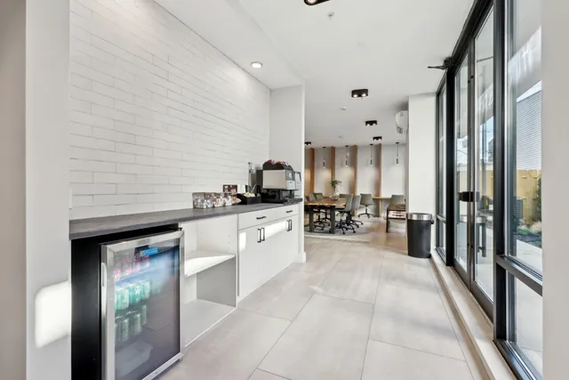 a kitchen with stainless steel appliances a refrigerator sink and cabinets