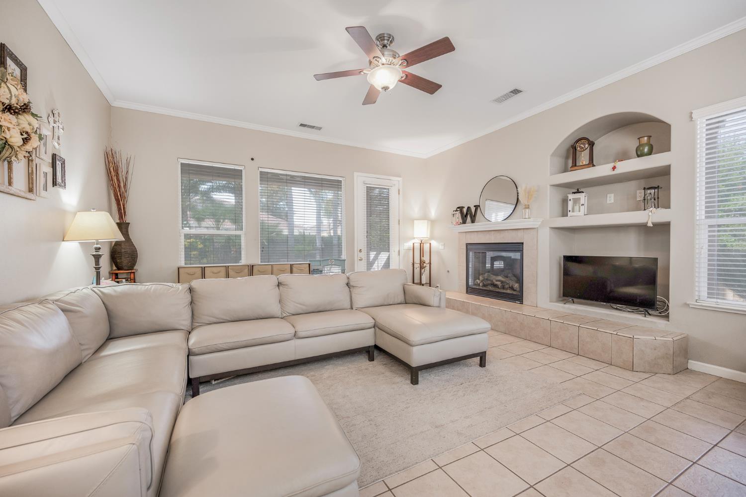 677 West Omaha Avenue Clovis, CA 93619 - Photo 12 of 35 a living room with furniture and a fireplace