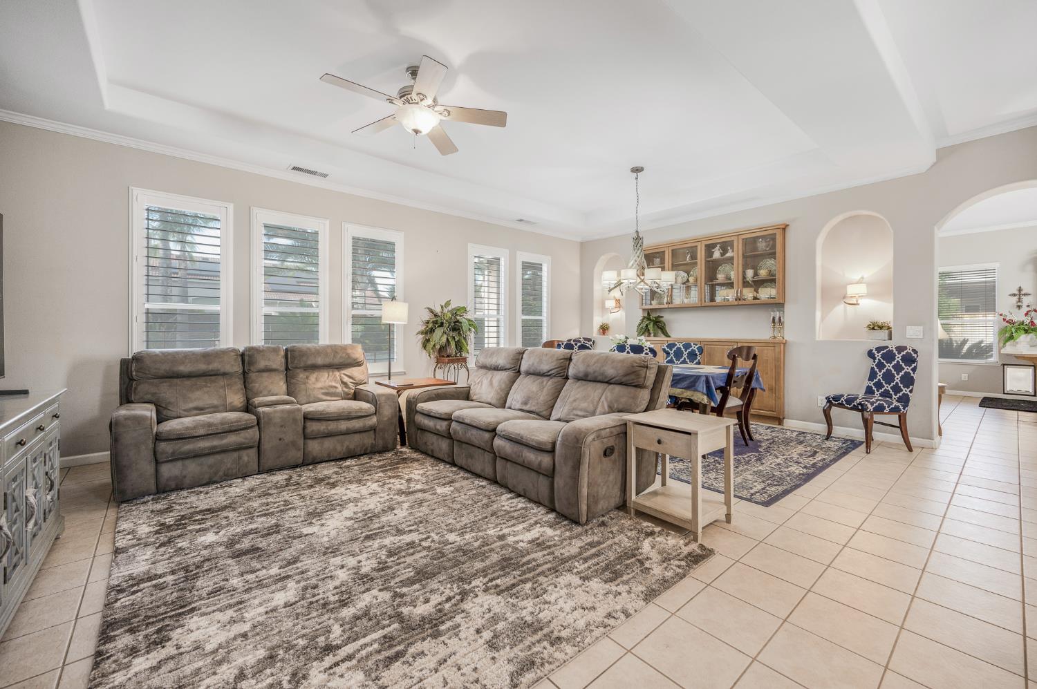 677 West Omaha Avenue Clovis, CA 93619 - Photo 16 of 35 a living room with furniture and a chandelier
