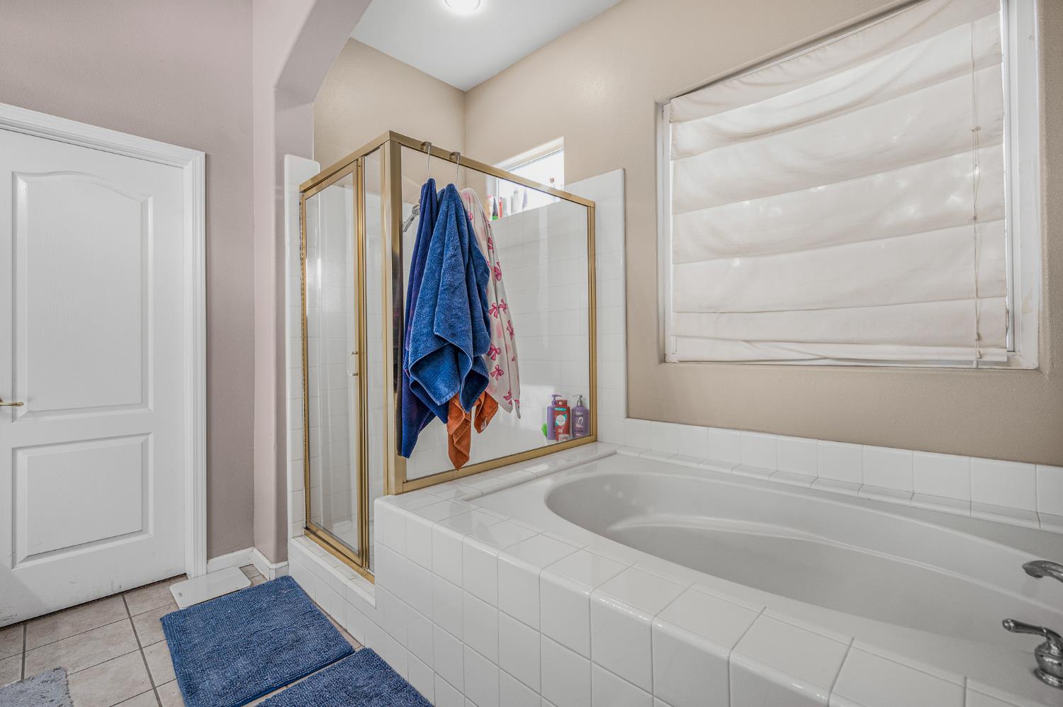 677 West Omaha Avenue Clovis, CA 93619 - Photo 21 of 35 a view of walk in closet with clothes and shoes