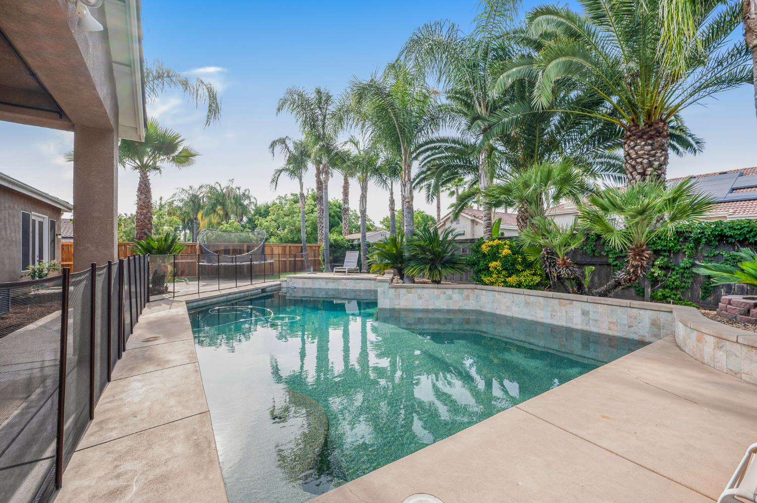 677 West Omaha Avenue Clovis, CA 93619 - Photo 29 of 35 a view of a swimming pool with a patio