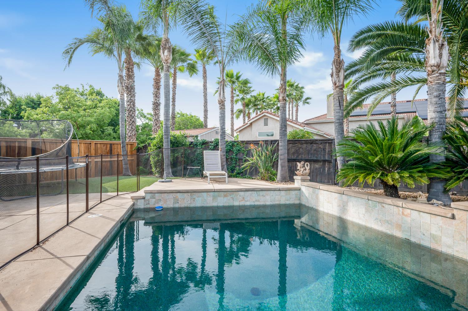 677 West Omaha Avenue Clovis, CA 93619 - Photo 30 of 35 a view of house with swimming pool and a patio