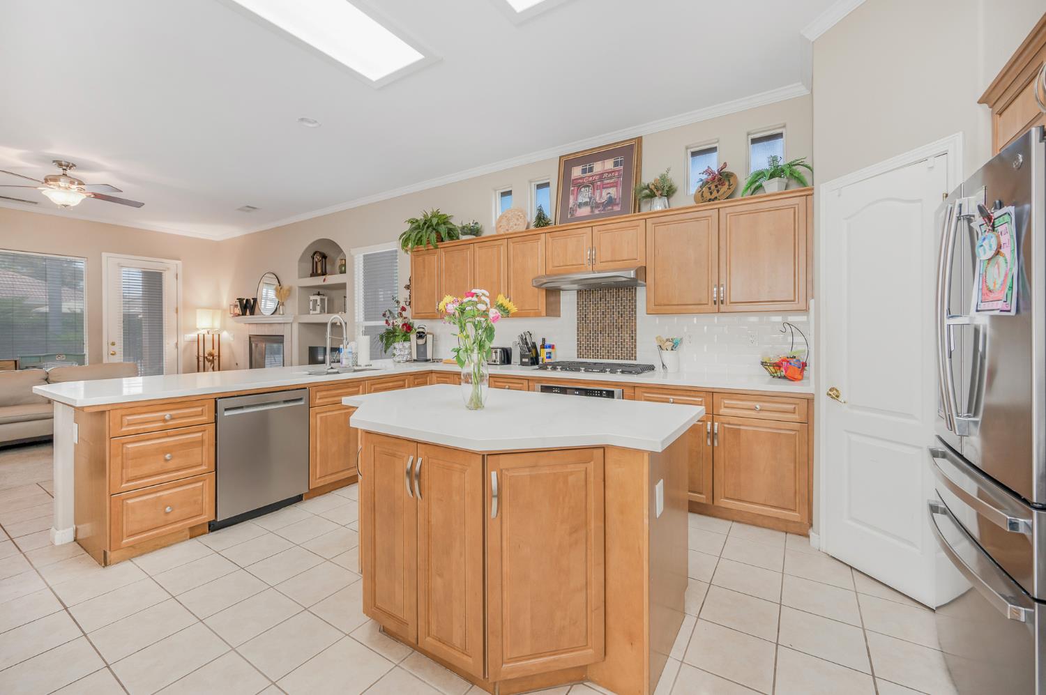 677 West Omaha Avenue Clovis, CA 93619 - Photo 8 of 35 a kitchen with stainless steel appliances granite countertop a sink and cabinets