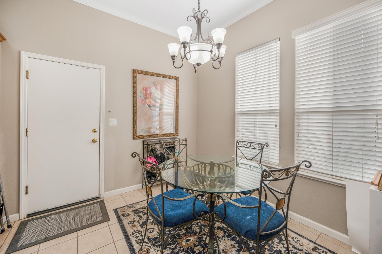 677 West Omaha Avenue Clovis, CA 93619 - Photo 9 of 35 a view of a dining room with furniture and wooden floor