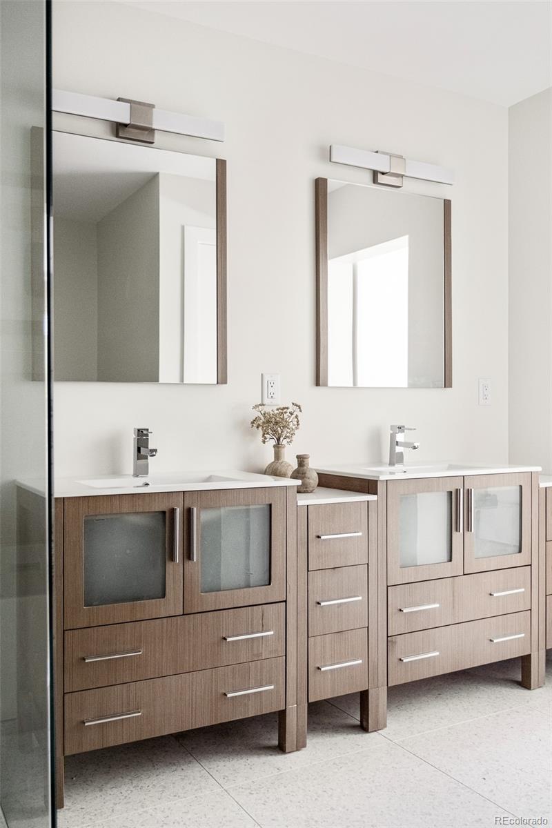 4461 Utica Street Denver, CO 80212 - Photo 19 of 40 a bathroom with a sink and a mirror