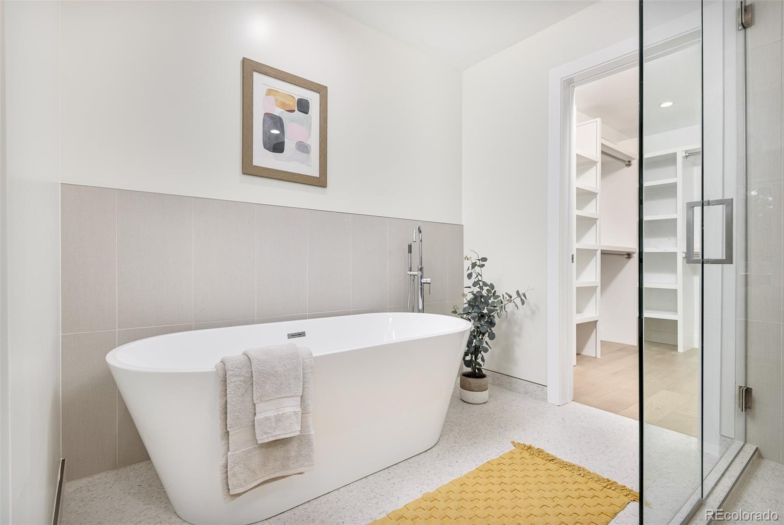 4461 Utica Street Denver, CO 80212 - Photo 20 of 40 a white bath tub sitting in a bathroom