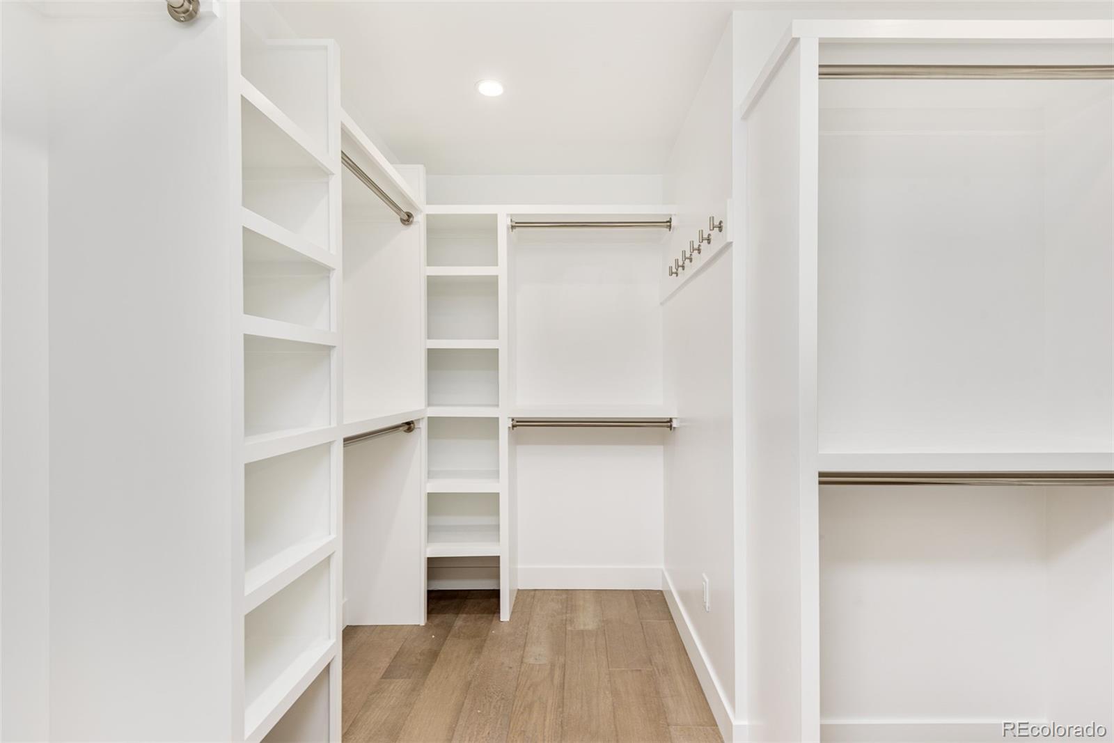 4461 Utica Street Denver, CO 80212 - Photo 23 of 40 a view of walk in closet with empty racks