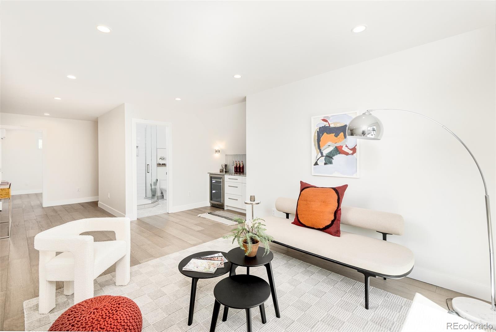 4461 Utica Street Denver, CO 80212 - Photo 27 of 40 a living room with furniture and white walls