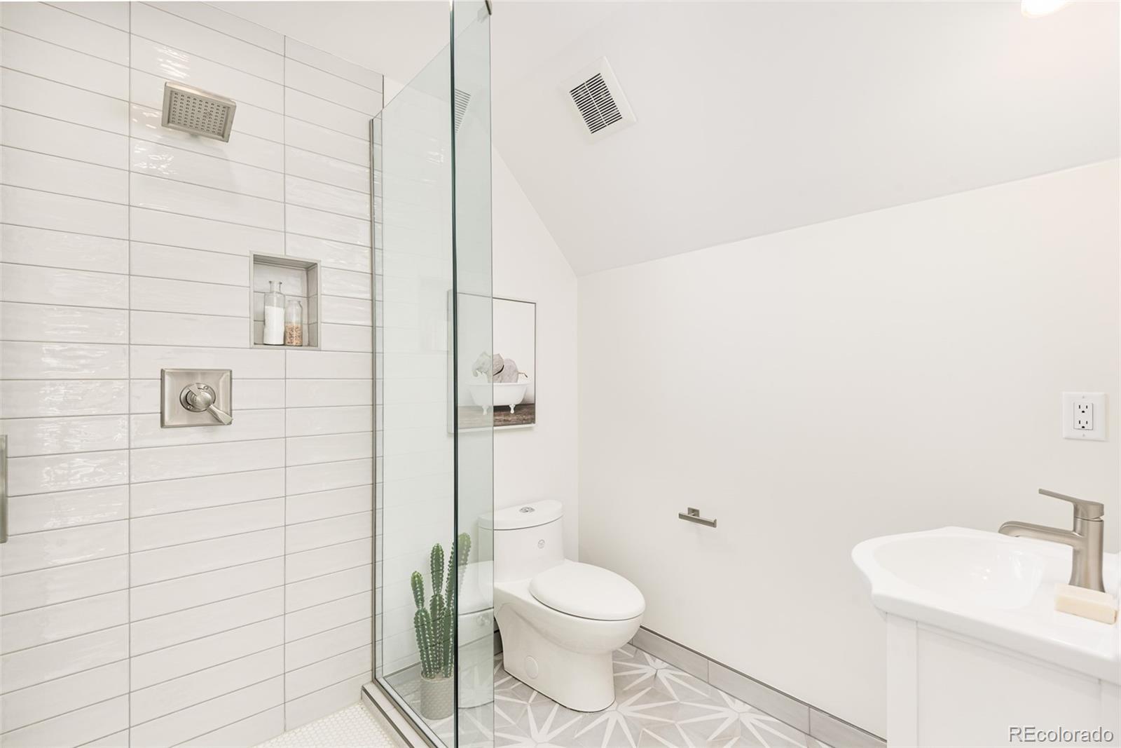 4461 Utica Street Denver, CO 80212 - Photo 30 of 40 a bathroom with a toilet and a shower