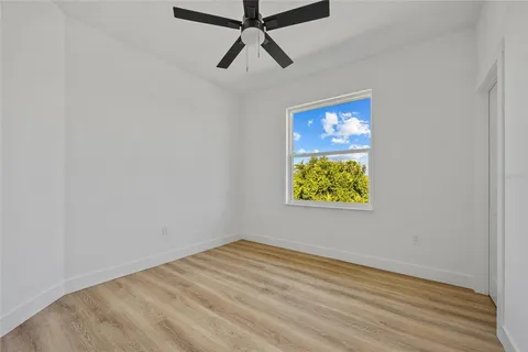 a view of room with window and ceiling fan
