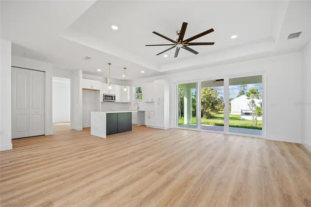 a view of a kitchen with a sink and a window