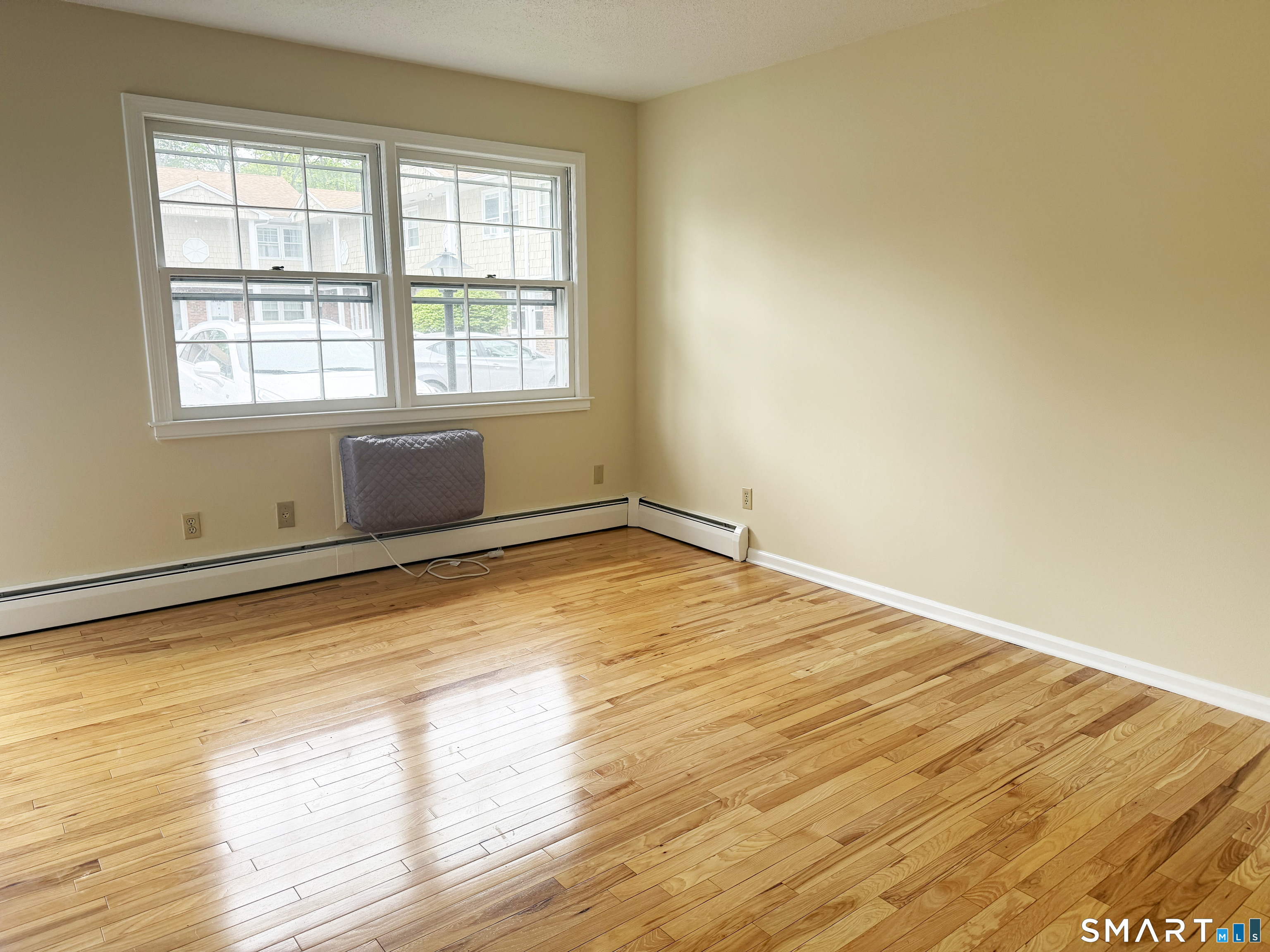 116 Commerce Street, Unit 5 Clinton, CT 06413 - Photo 12 of 18 a view of empty room with wooden floor and fan