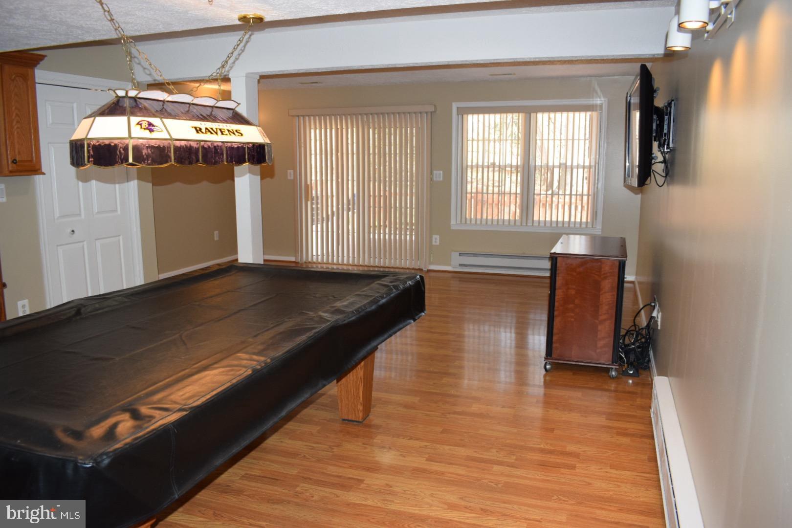 121 Carolstowne Road Reisterstown, MD 21136 - Photo 23 of 34 LOWER LEVEL FAMILY ROOM WITH POOL TABLE & TV