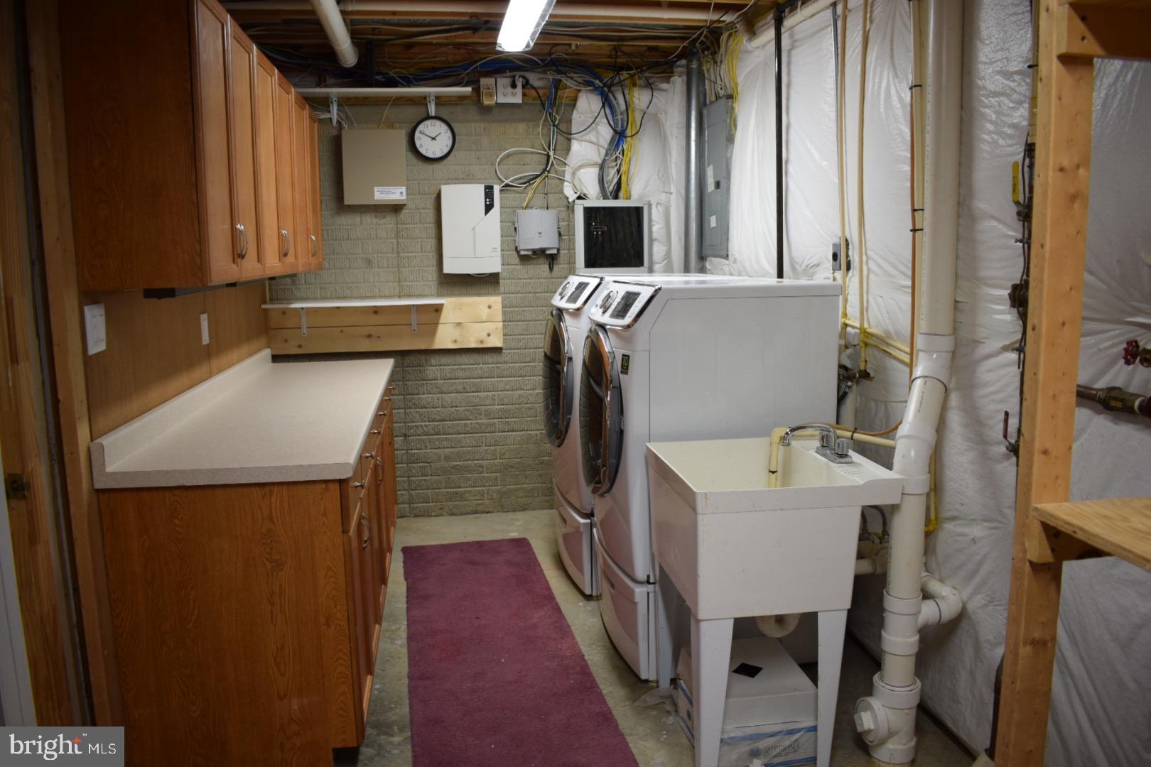 121 Carolstowne Road Reisterstown, MD 21136 - Photo 26 of 34 LAUNDRY ROOM VIEW WITH WORKSPACE