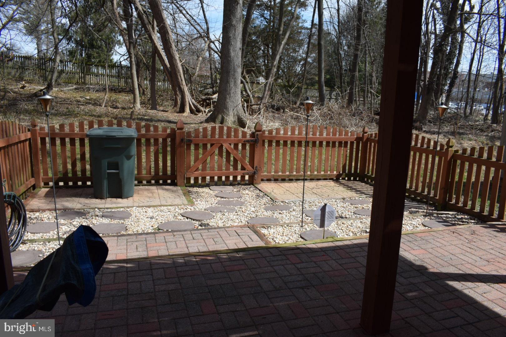 121 Carolstowne Road Reisterstown, MD 21136 - Photo 33 of 34 FENCED YARD LANDSCAPED WITH HARDSCAPE AND BRICK