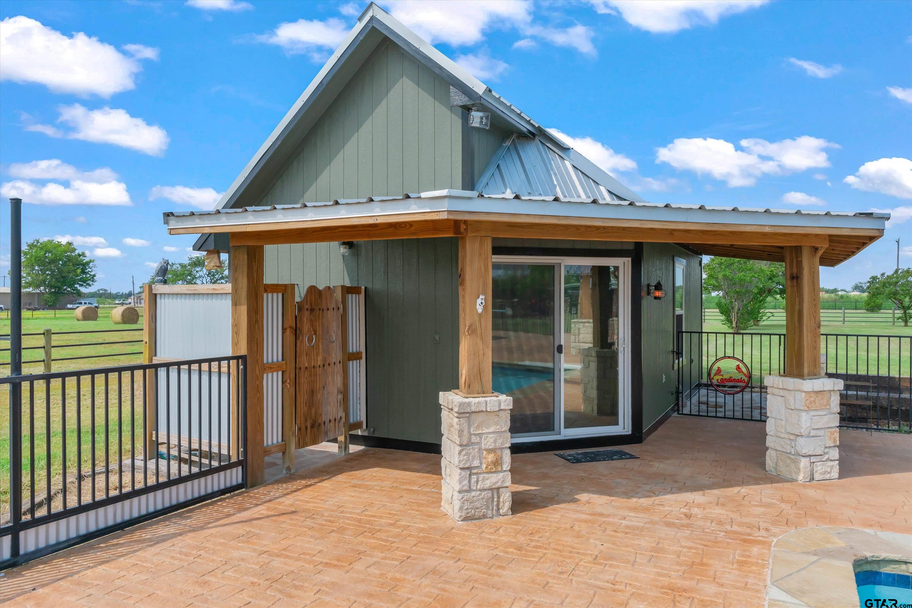 733 Rains County Road 1430 Point, TX 75472 - Photo 35 of 48 a view of a house with large windows and plants