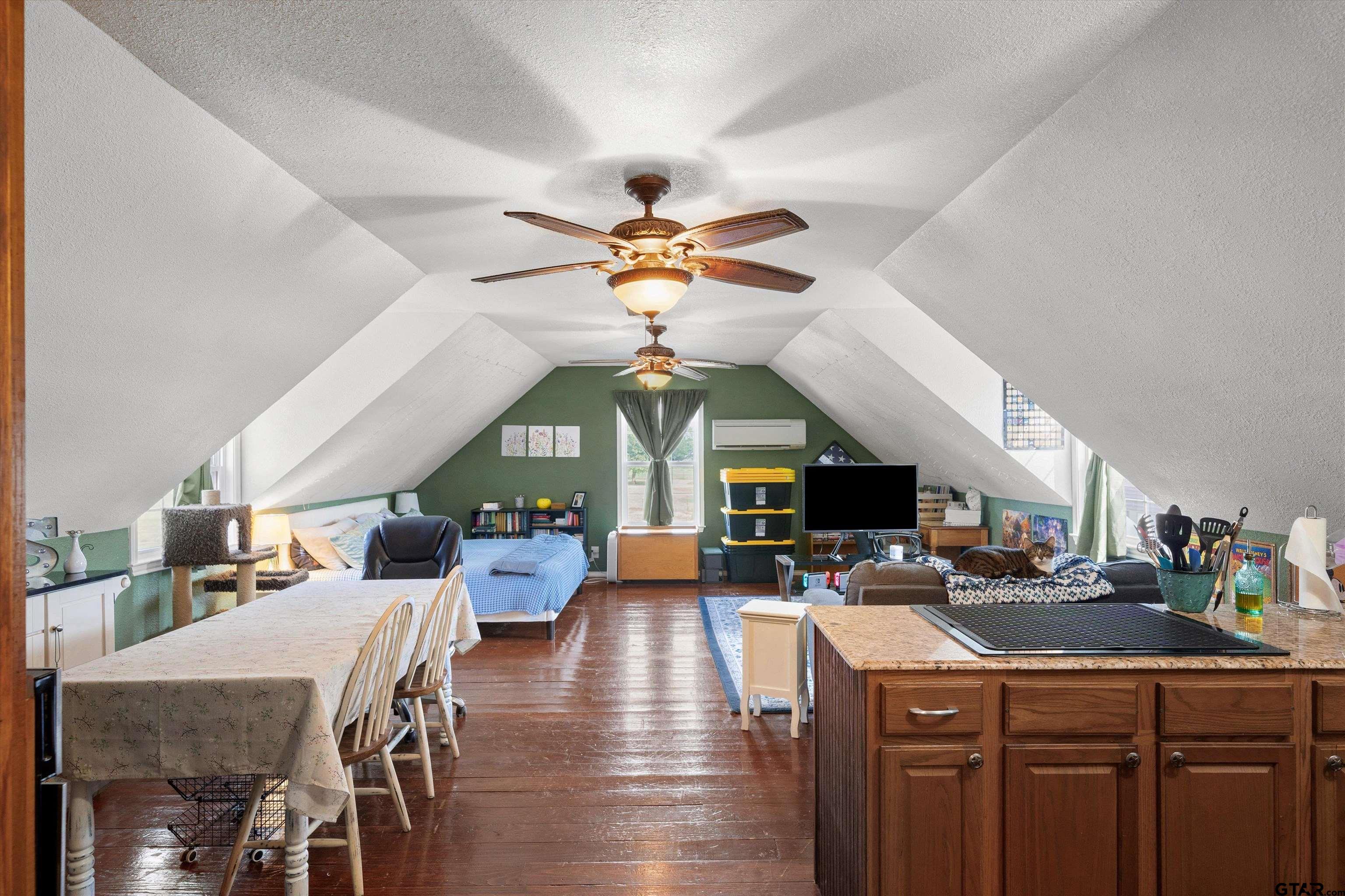 733 Rains County Road 1430 Point, TX 75472 - Photo 39 of 48 a kitchen with a stove a refrigerator a dining table and chairs with wooden floor