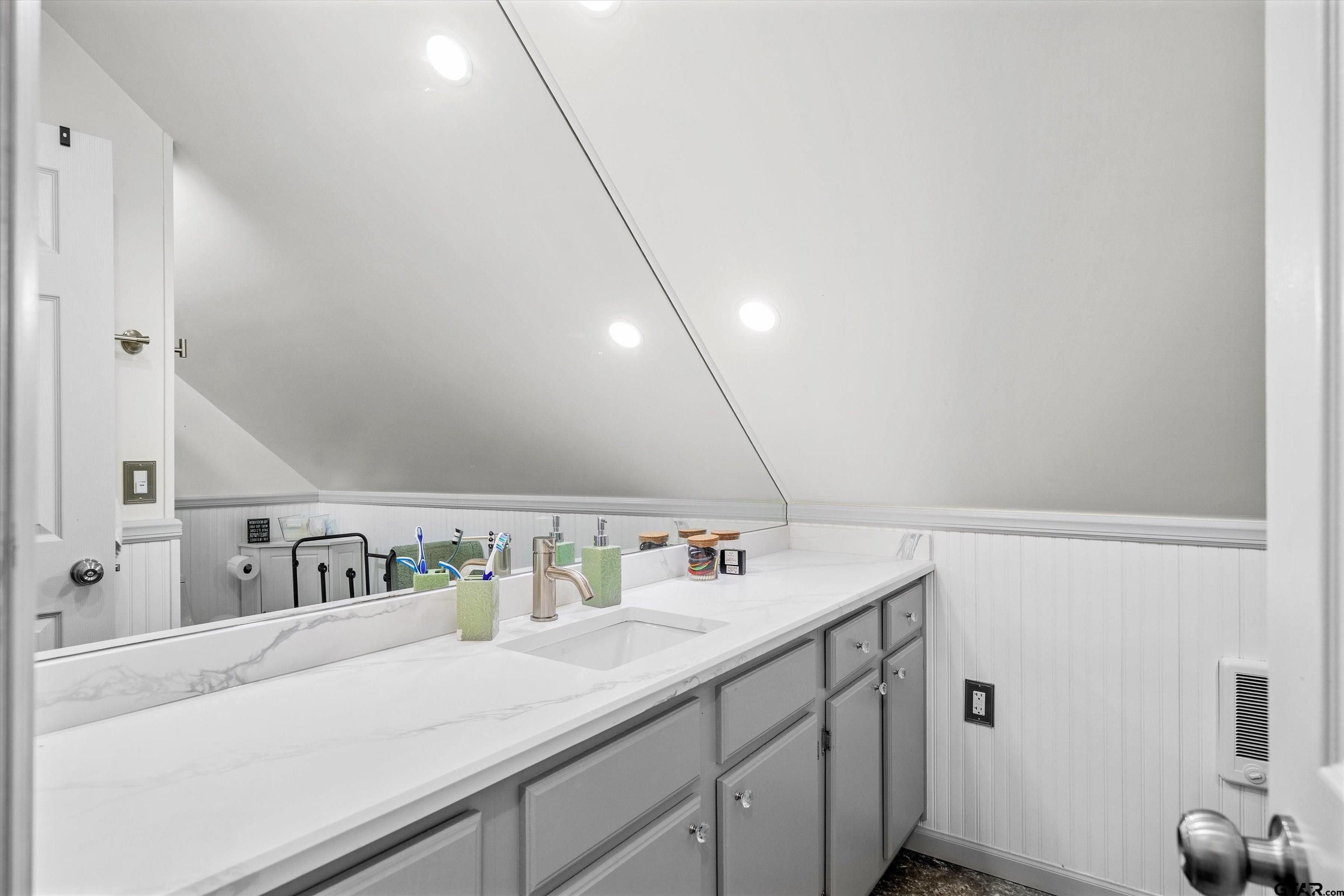 733 Rains County Road 1430 Point, TX 75472 - Photo 40 of 48 a bathroom with a sink and a mirror