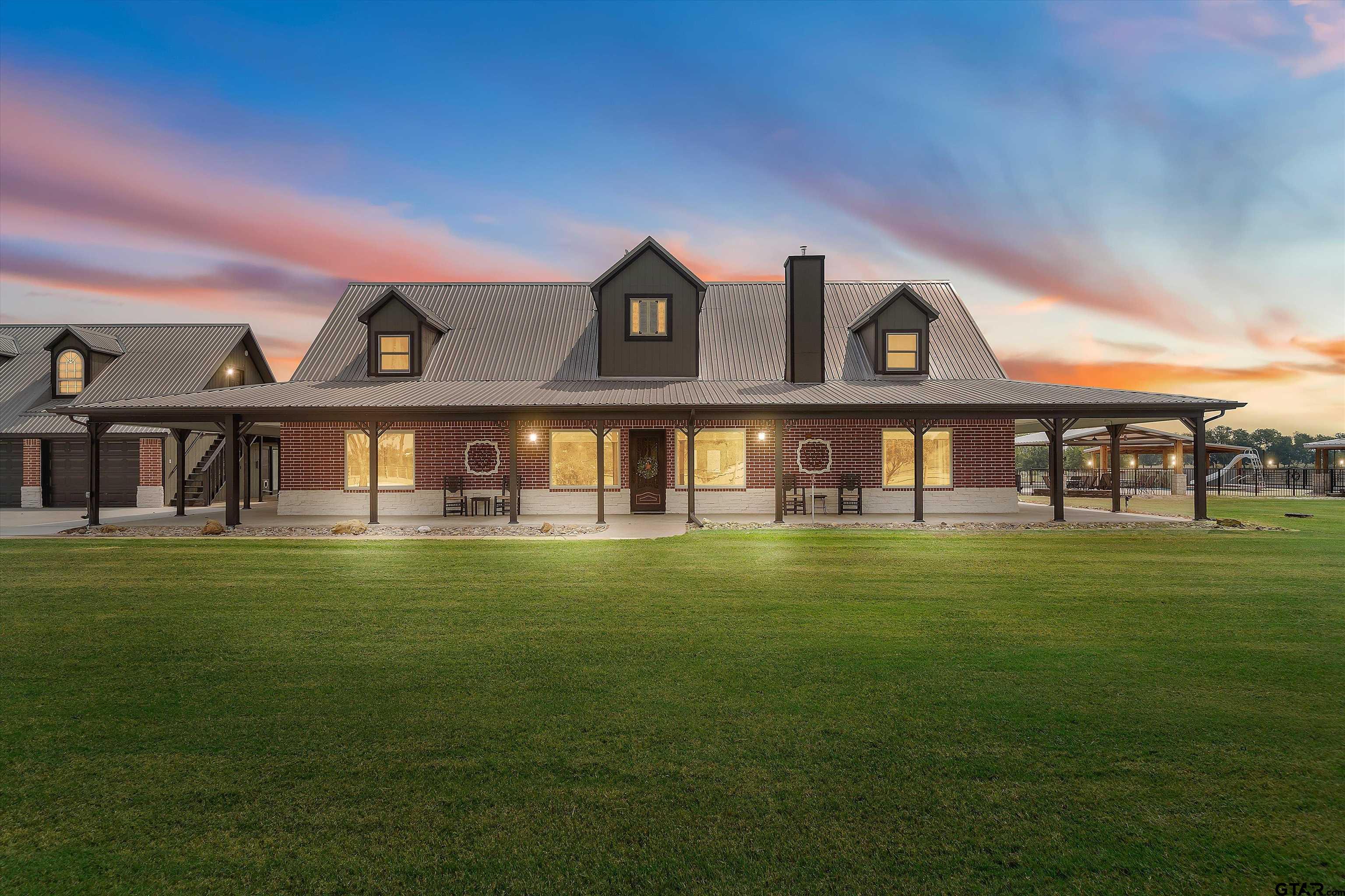 733 Rains County Road 1430 Point, TX 75472 - Photo 4 of 48 a front view of a house with a garden