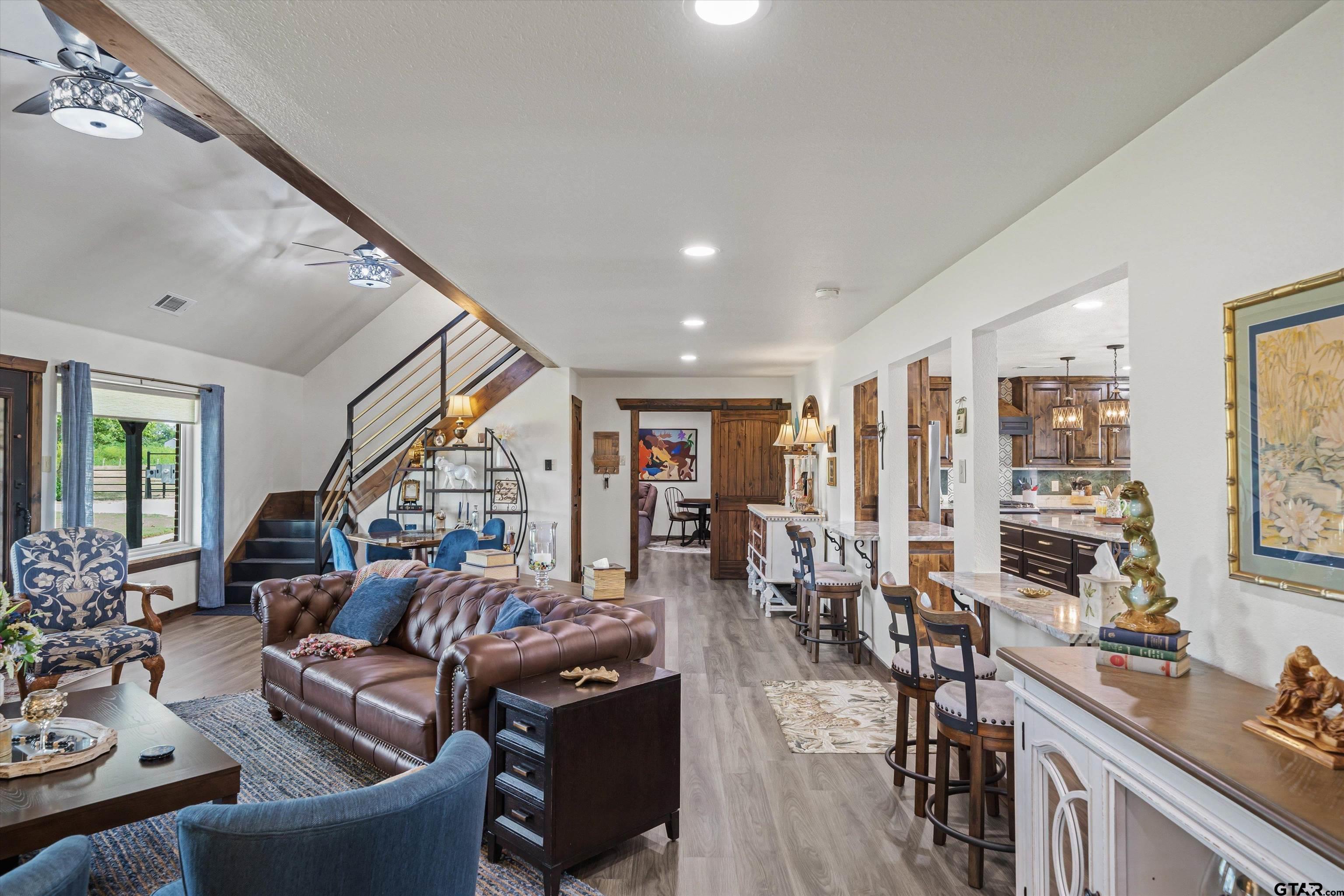 733 Rains County Road 1430 Point, TX 75472 - Photo 10 of 48 a living room with lots of furniture and hard wood flooring