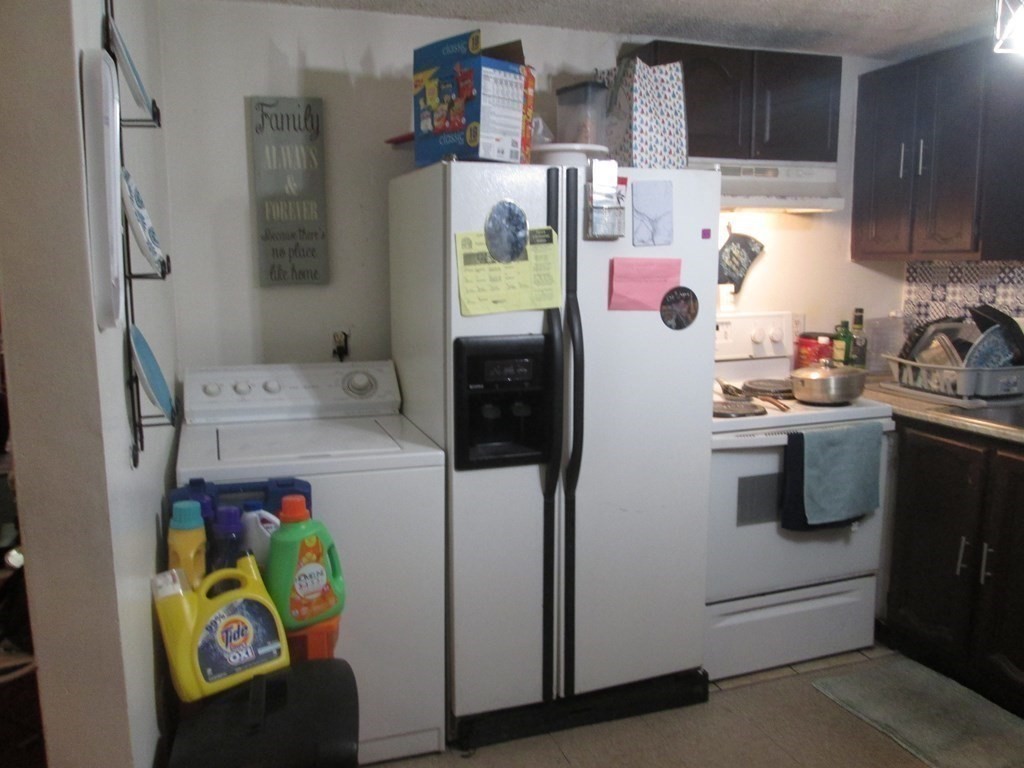 144 Cherry Street Springfield, MA 01105 - Photo 19 of 25 a kitchen with stainless steel appliances a refrigerator sink and microwave