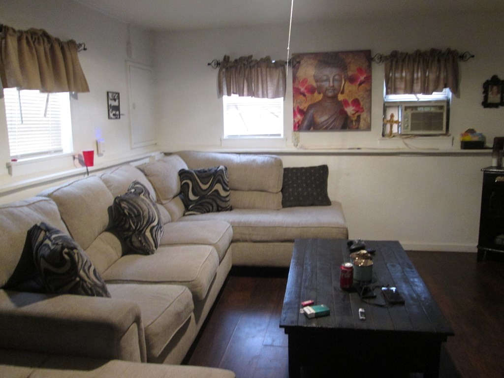 144 Cherry Street Springfield, MA 01105 - Photo 4 of 25 a living room with furniture and a window