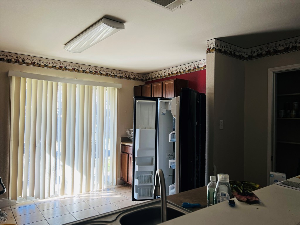 13024 Amaryllis Trail Elgin, TX 78621 - Photo 5 of 9 Sliding glass door leads to back yard.