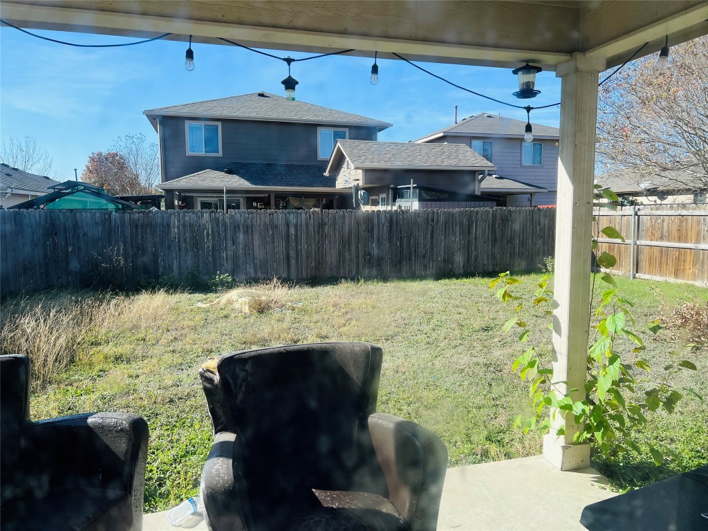 13024 Amaryllis Trail Elgin, TX 78621 - Photo 9 of 9 Spacious backyard with covered patio.