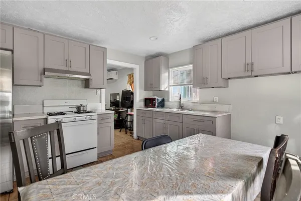 a kitchen with sink cabinets and window