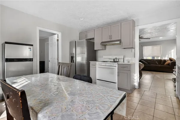 a kitchen with stainless steel appliances a refrigerator sink and cabinets