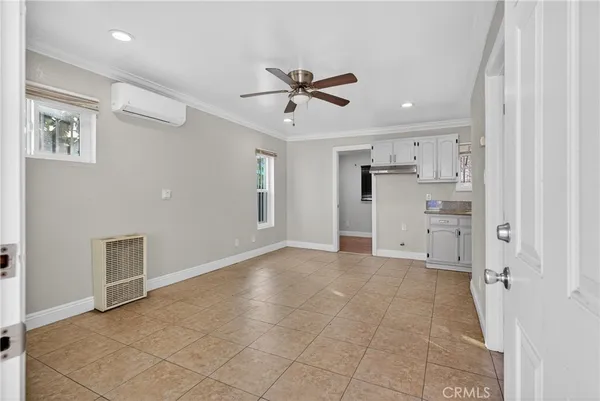 a view of a livingroom with a kitchen