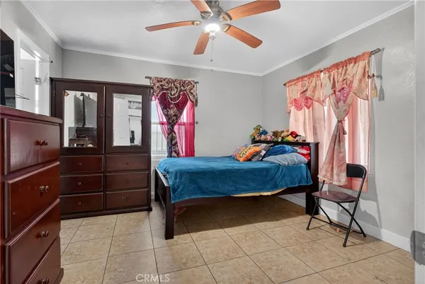 a bed room with a bed and a window
