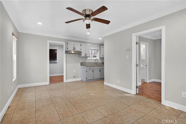 a view of a kitchen with a sink and a refrigerator