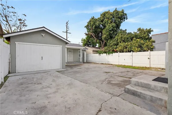 a view of a house with a yard and garage