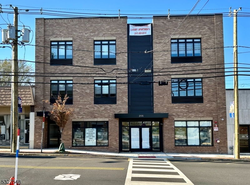 205 Stuyvesant Avenue, Unit 203 Lyndhurst, NJ 07071 - Photo 2 of 14 a building that has a lots of windows on it