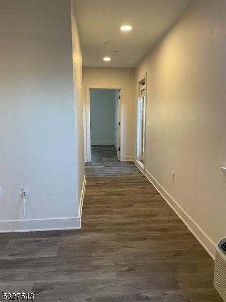 205 Stuyvesant Avenue, Unit 203 Lyndhurst, NJ 07071 - Photo 6 of 14 a view of hallway with wooden floor