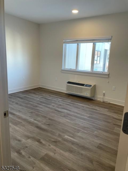 205 Stuyvesant Avenue, Unit 203 Lyndhurst, NJ 07071 - Photo 7 of 14 a view of a room with wooden floor and a window